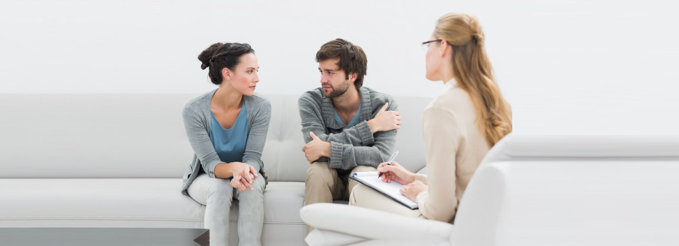 couple in meeting with a relationship therapist in her office